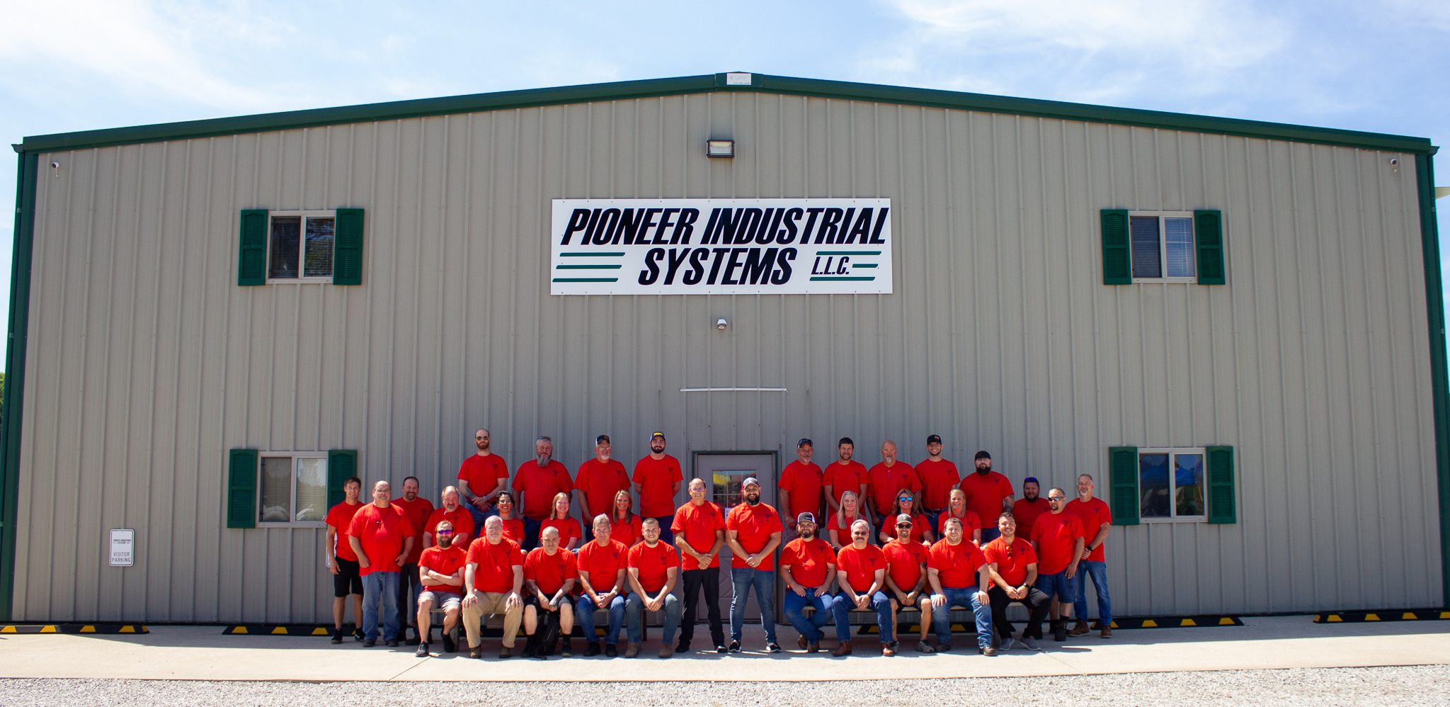 robotic integrator Pioneer Industrial Systems' team out in front of their design and build headquarters