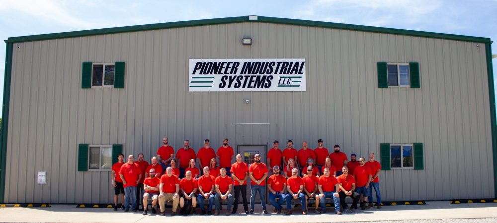 robotic integrator Pioneer Industrial Systems' team out in front of their design and build headquarters